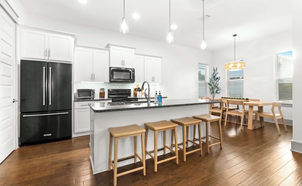 Open Kitchen with island seating and dining area