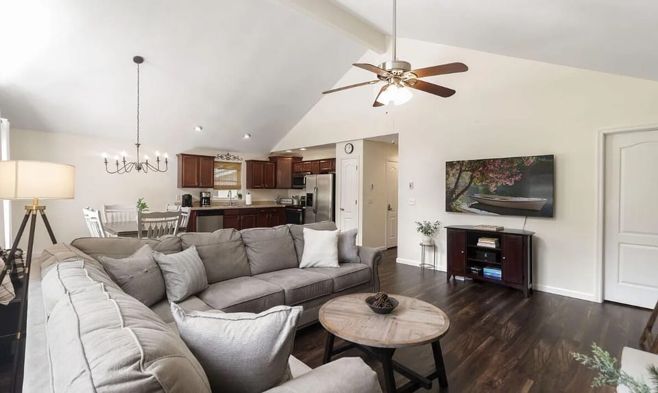 Living room, smart TV, ceiling fan, large 6 seater sofa