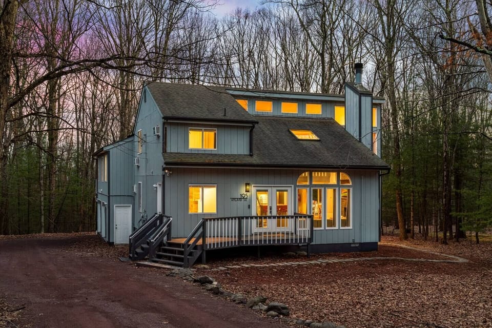 Charming Pocono retreat nestled among the trees, featuring a spacious layout and inviting outdoor areas. A peaceful getaway surrounded by nature, perfect for relaxing and recharging.