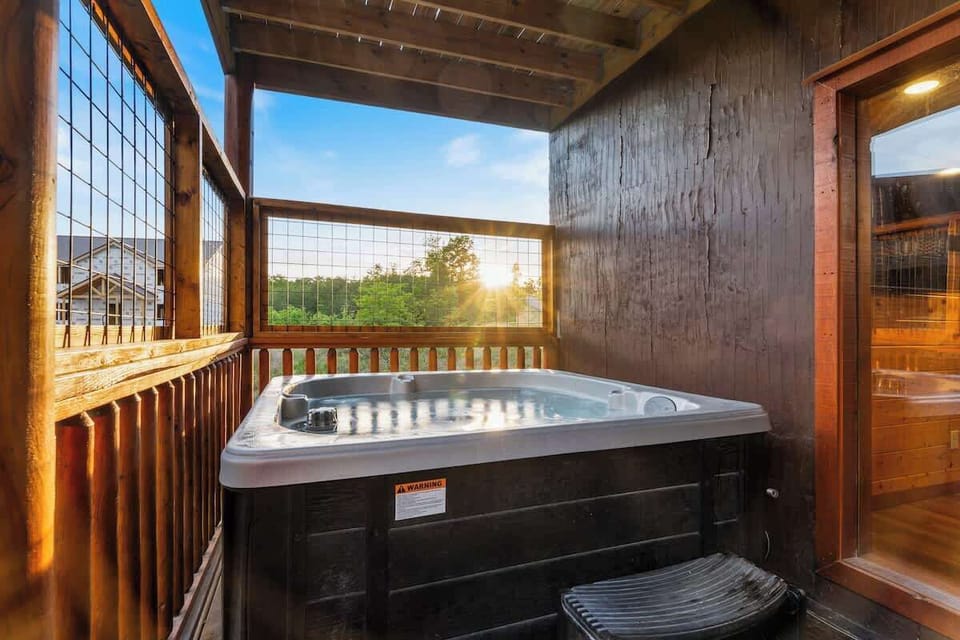 Private covered hot tub with sunset views and adjacent sauna retreat