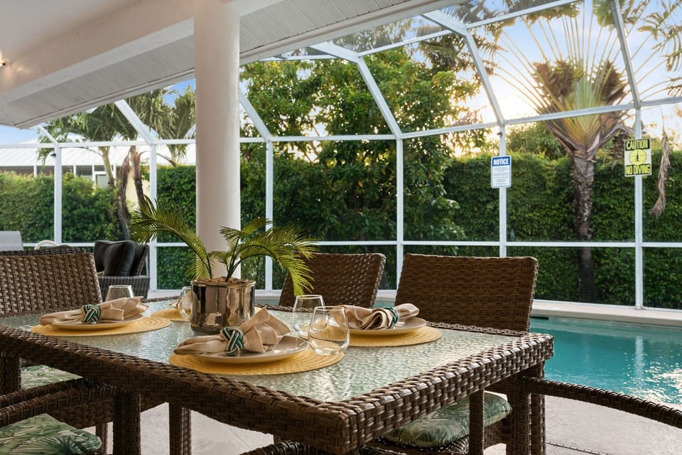 Dining Area: Savor meals poolside with lush views and a touch of tropical elegance!