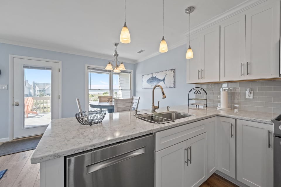 Cook and clean with ease—this kitchen features a dishwasher and plenty of counter space for meal prep.