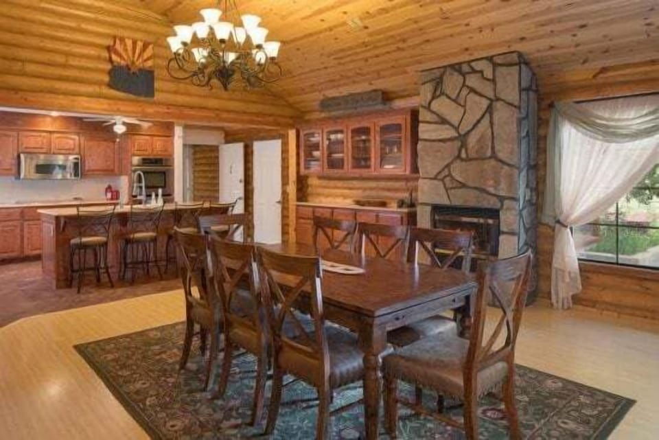 Chef's Kitchen: Fully equipped with double ovens, a six-burner stove, two dishwashers, and seating for the whole group.