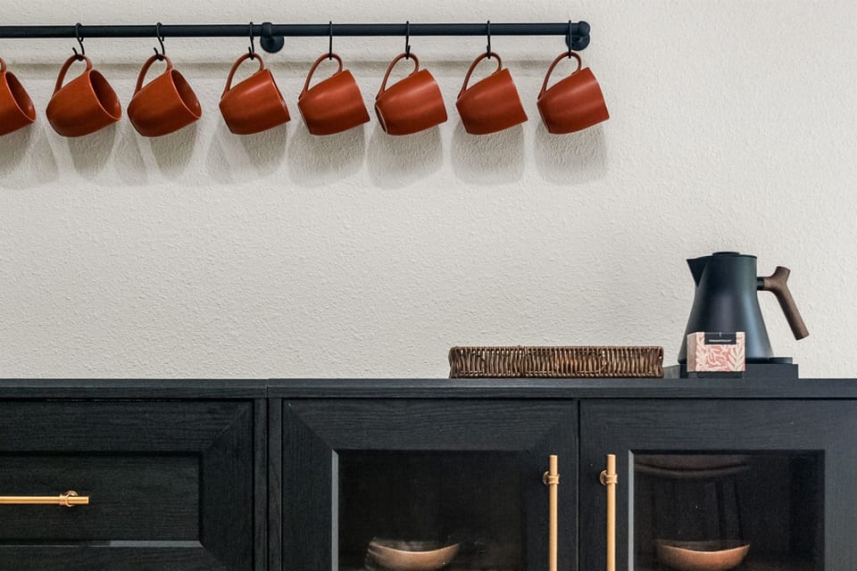 A coffee and tea bar features high-end Fellow kettle, brewer, and grinder with local gourmet coffee and Smith's tea provided