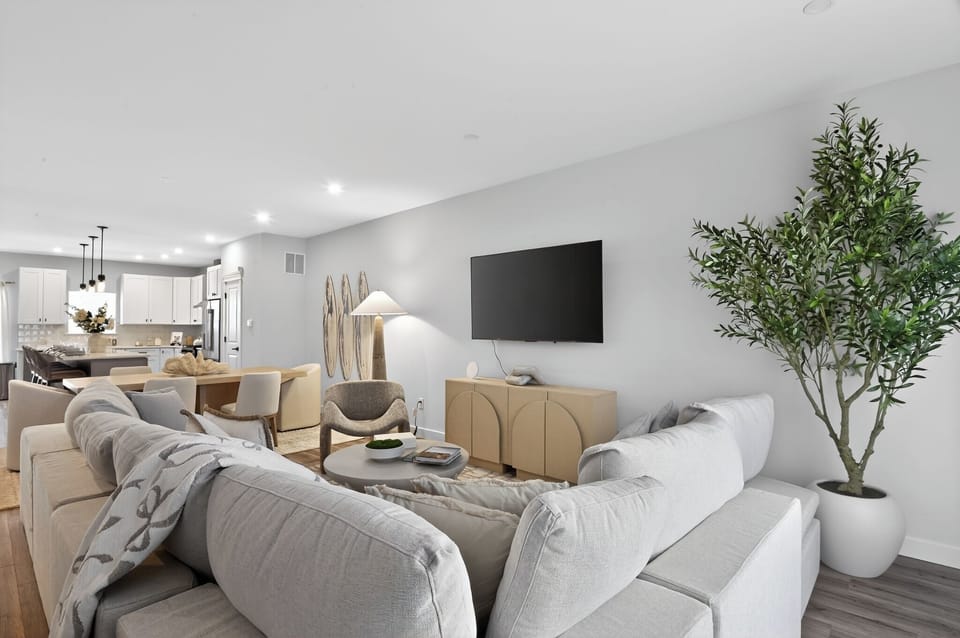 open concept living room with TV, games and room to enjoy family fun!