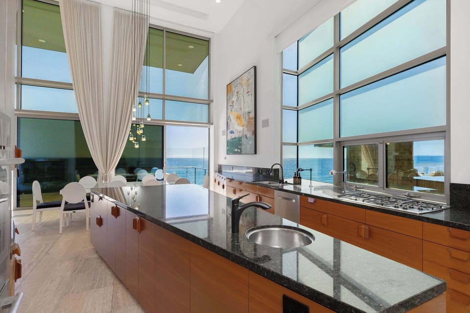 Contemporary kitchen with clean lines inside a Malibu beachfront estate.