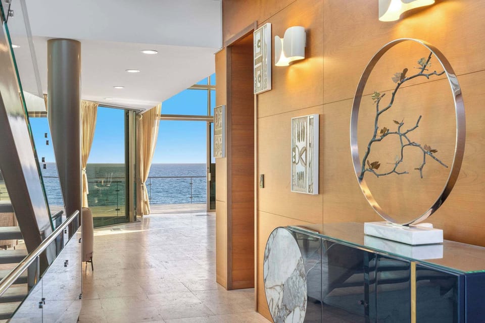 A rare double-lot oceanfront property offering exceptional Malibu privacy.