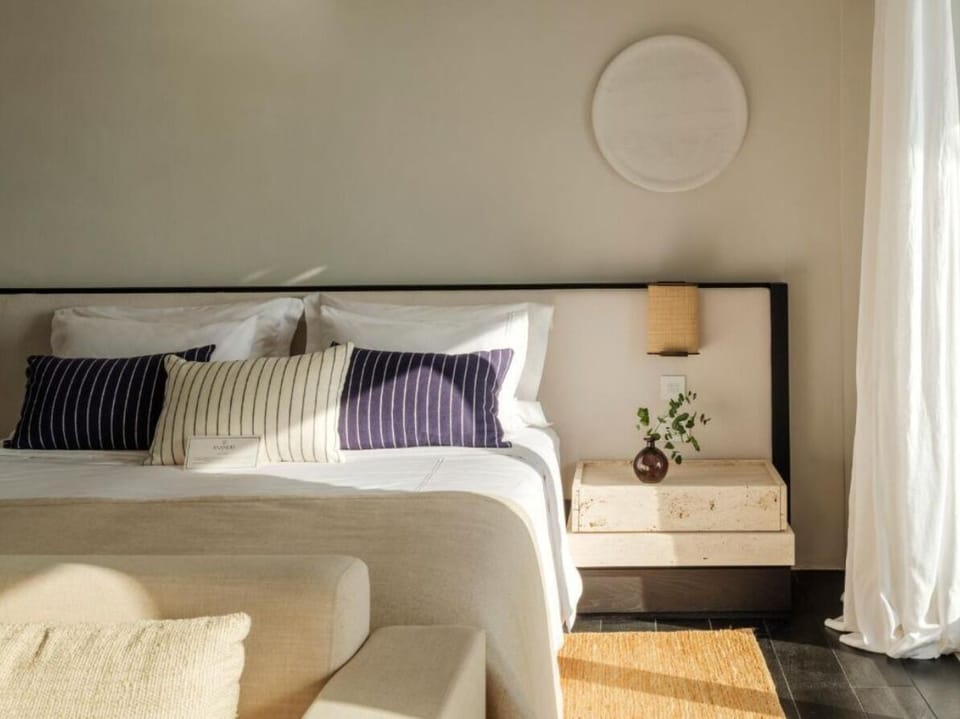 Unwind in crisp linens and soft sunlit serenity.