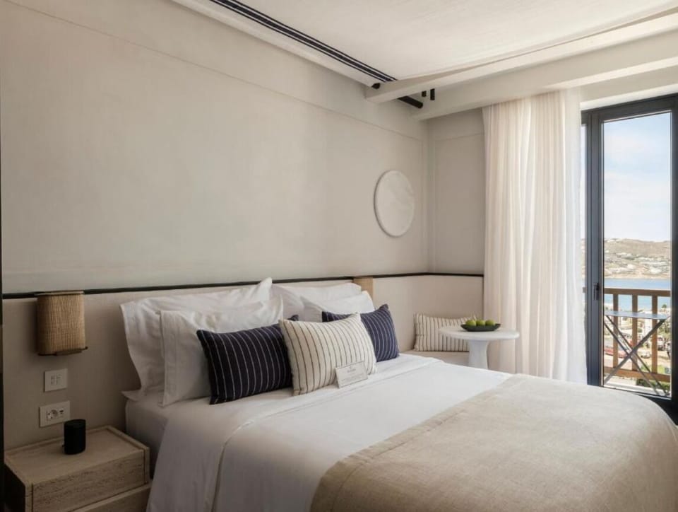 Sink into crisp linens and enjoy calm, coastal design.