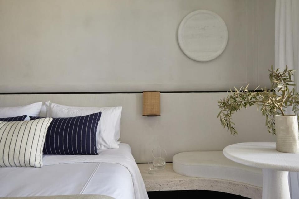 Sink into plush pillows and savor minimalist, calming design.