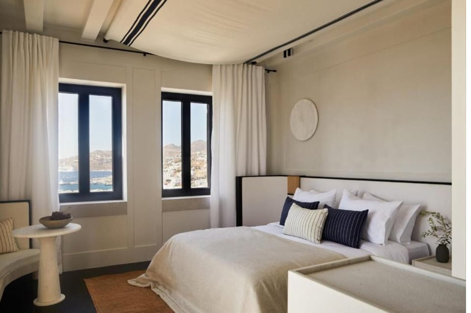 Wake to sunlit windows and calming coastal scenery.