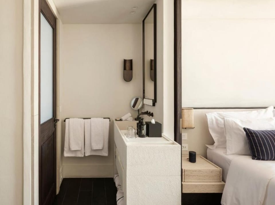 Refresh at the minimalist vanity with plush towels ready.