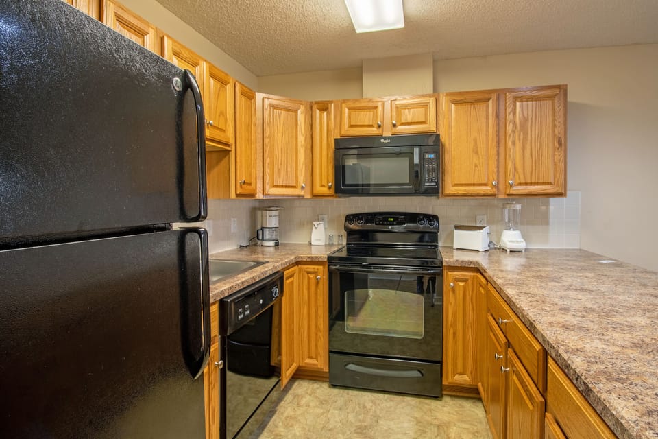 Full kitchen includes stove, oven top, refrigerator, dishwasher, and more!