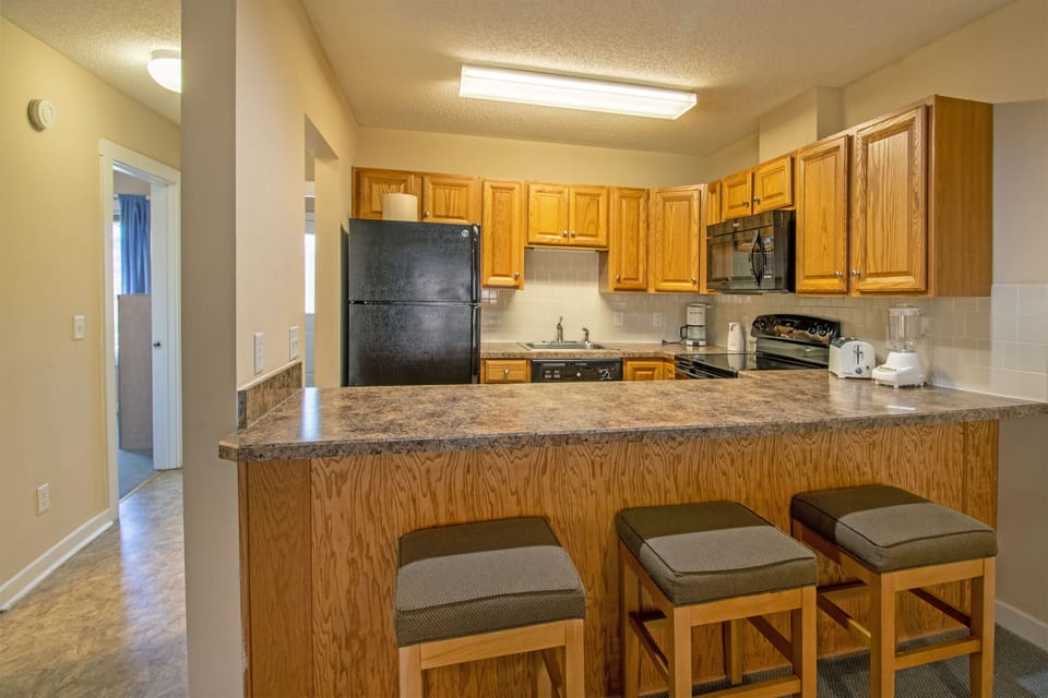 Full kitchen and bar seating 