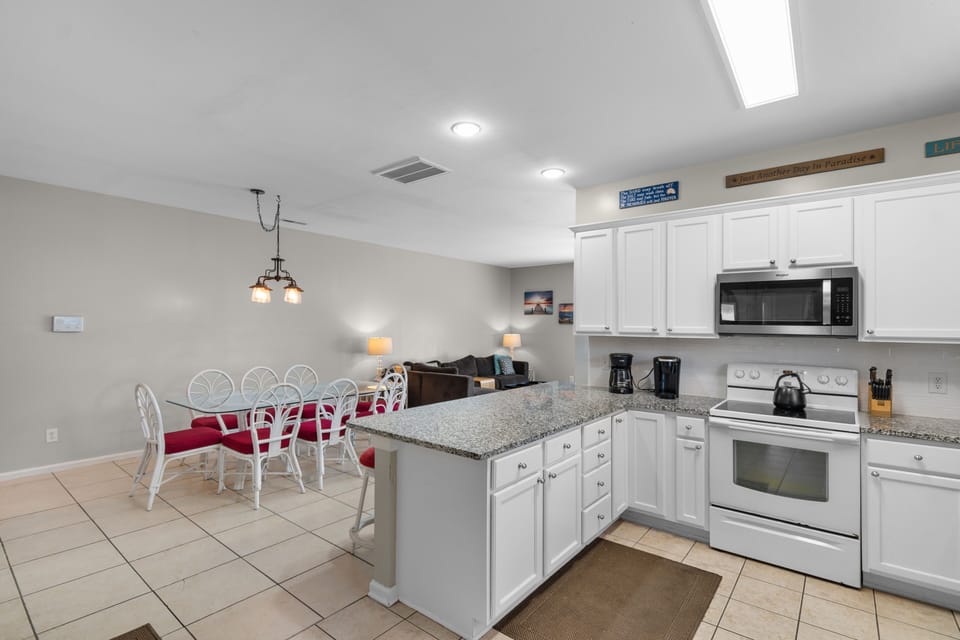 Your spacious kitchen features a dining area where you'll savor morning coffee and home-cooked meals together.
