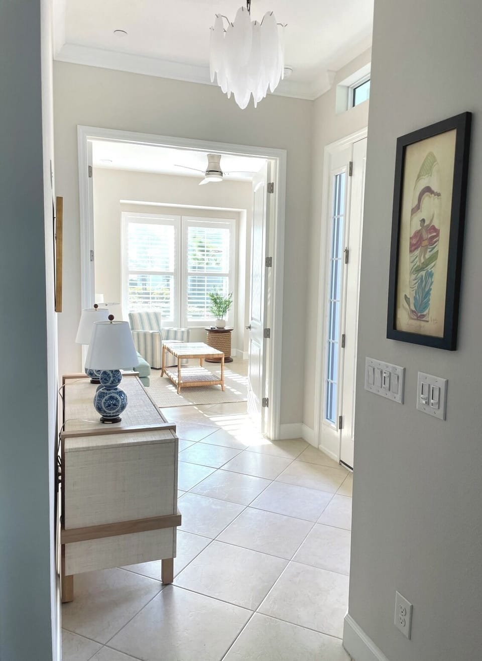 Step into your bright, sophisticated space where coastal elegance meets comfort through airy rooms and stylish furnishings.