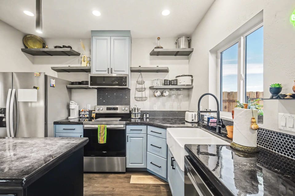 Fully equipped modern kitchen with stainless appliances and everything you need to cook at home