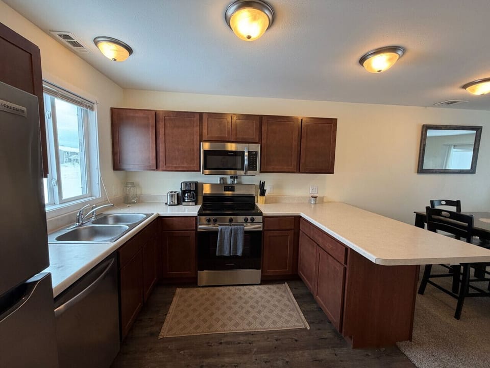 Full kitchen setup stainless appliances and plenty of counter space