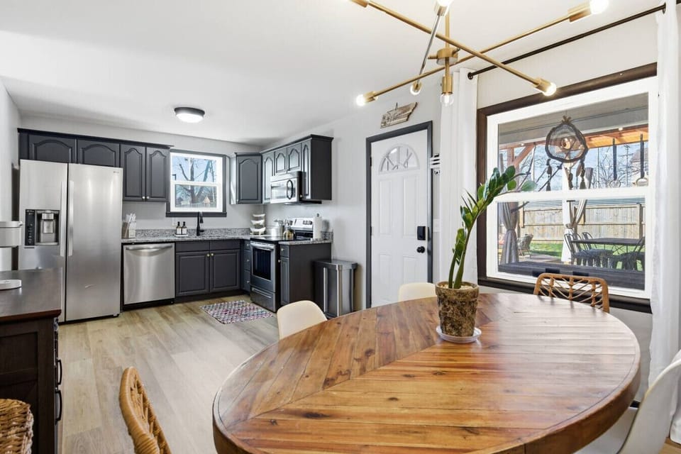 The kitchen is fully equipped with high-end appliances and all the cooking essentials you may need. Enjoy meals at the dining table.