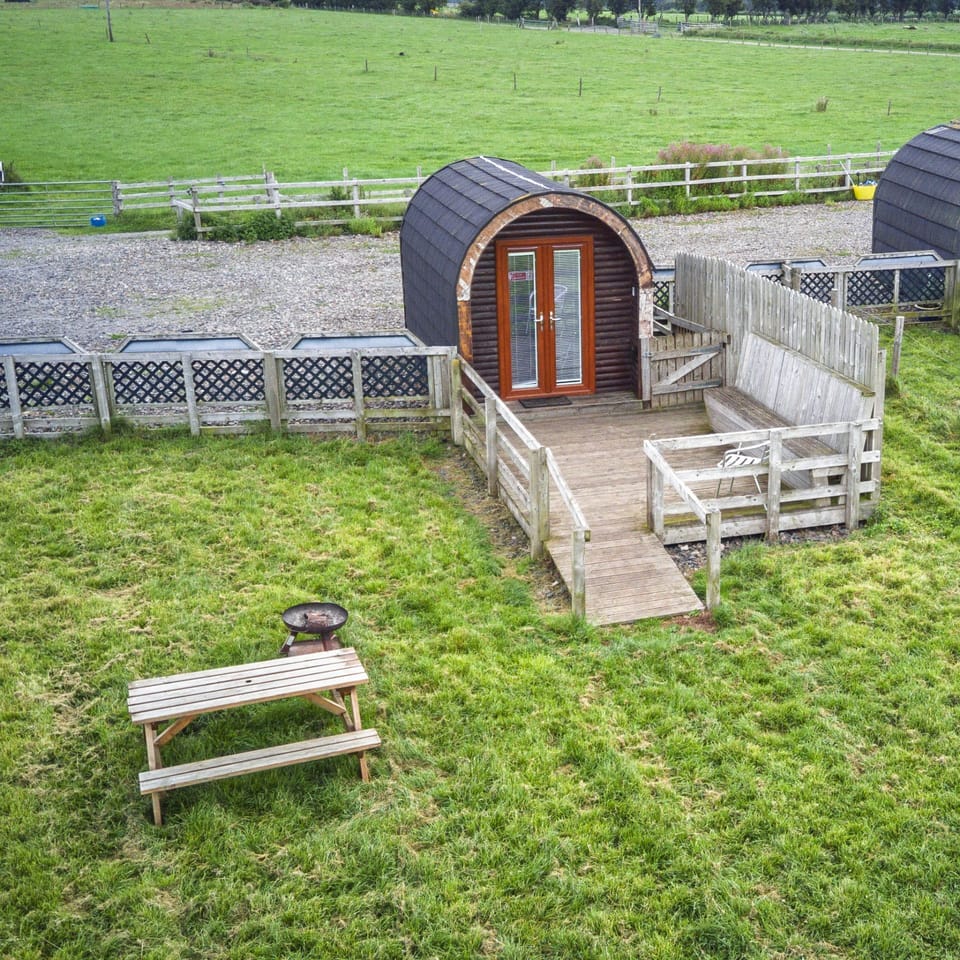 aerial view of the front of the property and enclosed garden