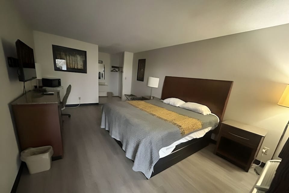 Unwind in a spacious king room with work desk.
