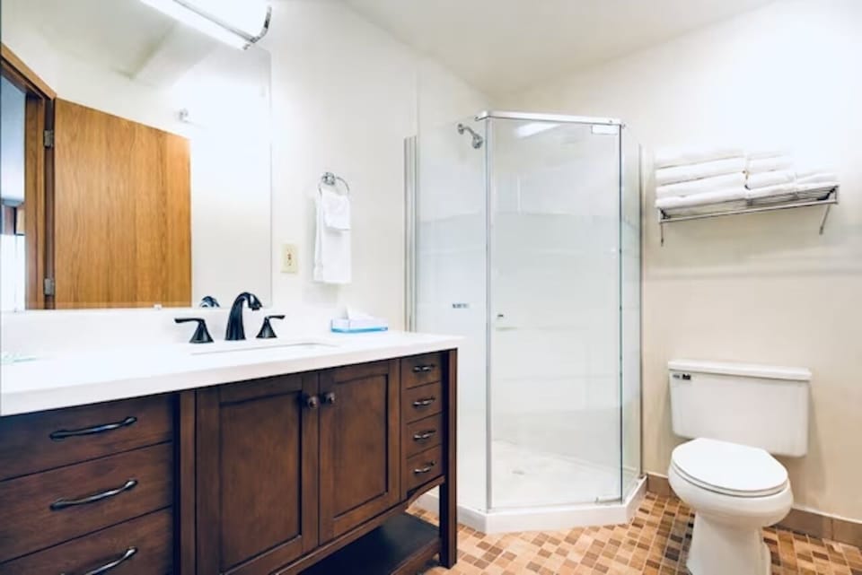 Refresh in a bright bathroom with a spacious walk-in shower.