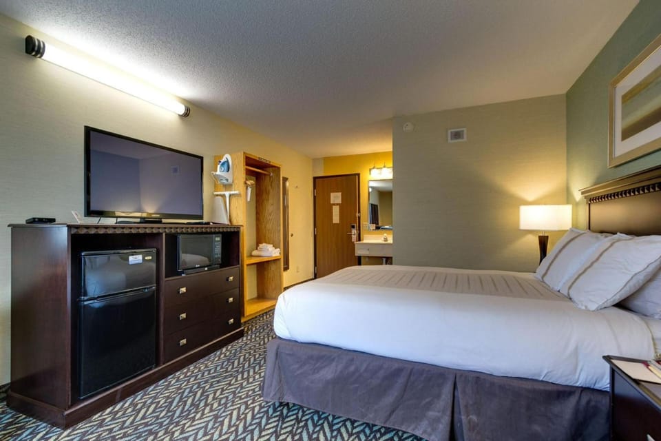 Unwind in a spacious room with TV and mini-fridge.