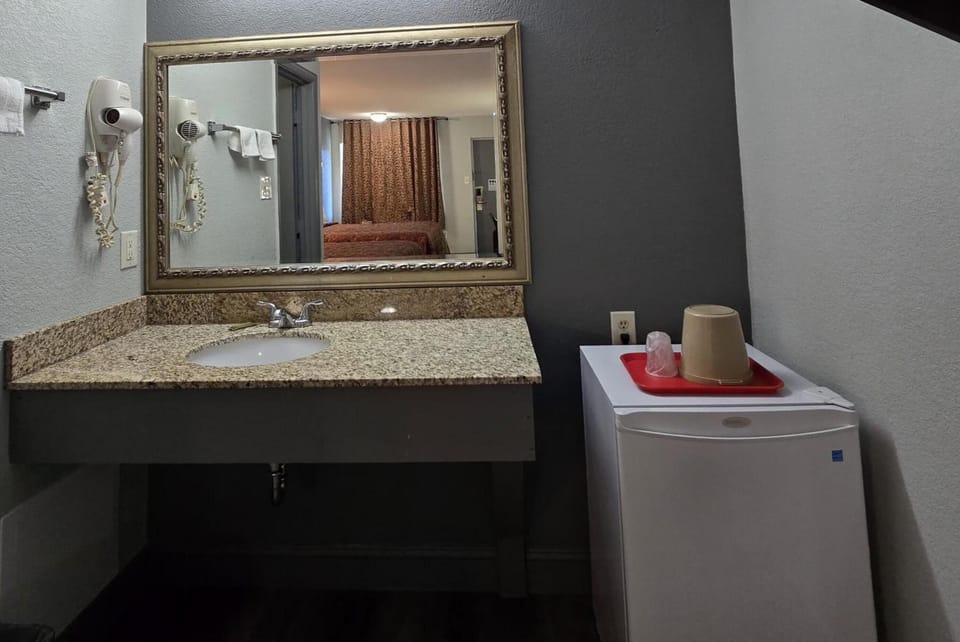 Refresh easily with vanity sink and handy in-room mini fridge.