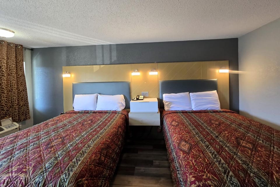 Settle into two comfy beds under warm, flattering lights.