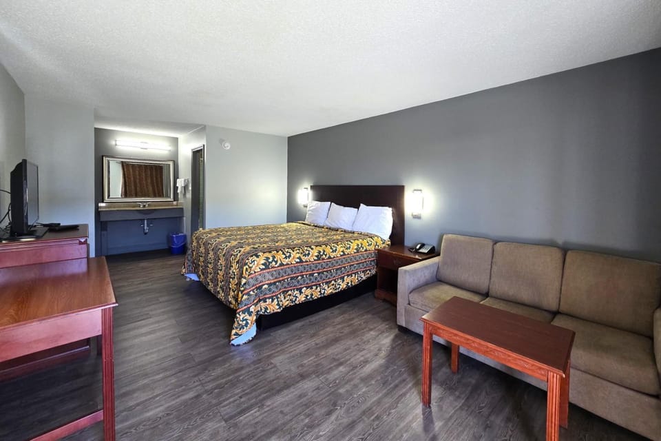 Arrive and unwind in a spacious king room with sofa.