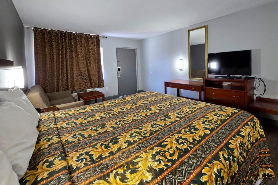 Kick back with a king bed, desk, and big-screen TV.