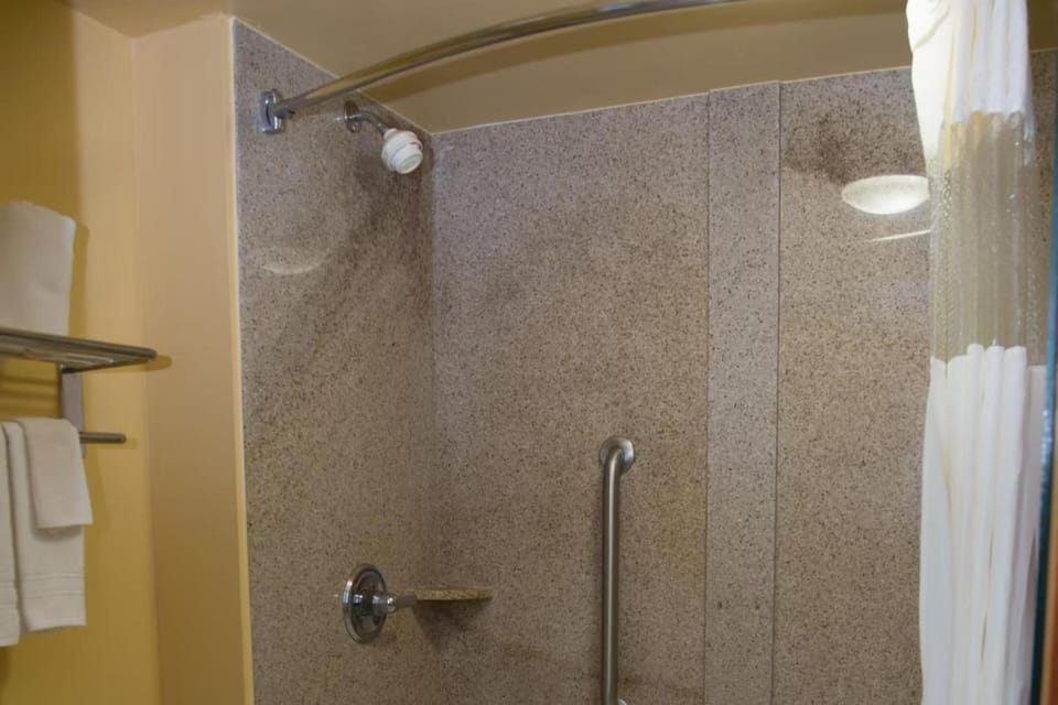 a shower in a bathroom with a shower curtain at Townhouse Fort Walton Beach Hurlburt Field in Mary Esther