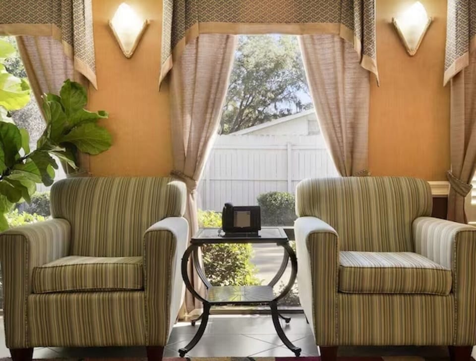 Unwind in cozy seating while sunlight streams through the windows.