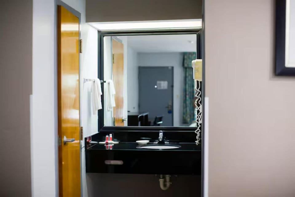 Freshen up easily with a wide vanity and bright mirror.