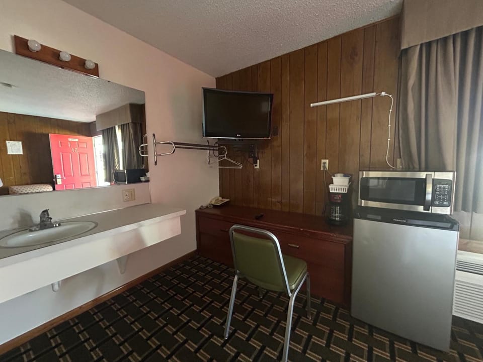 Settle in with microwave snacks, mini-fridge drinks, and TV.