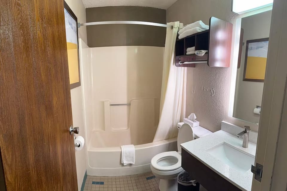 Refresh easily with a bright vanity and shower-tub combo.