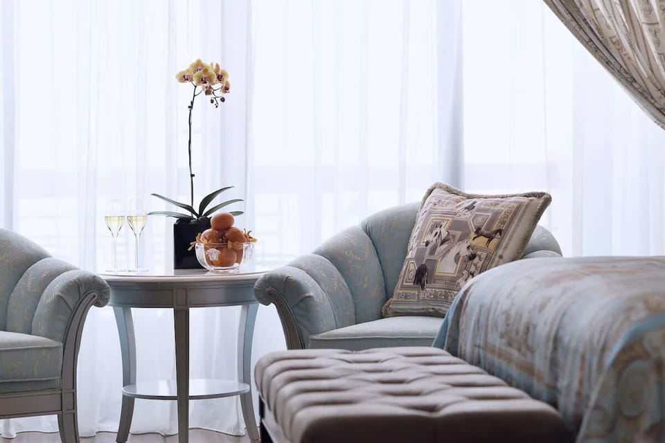 Sip morning champagne by the window in plush armchairs.