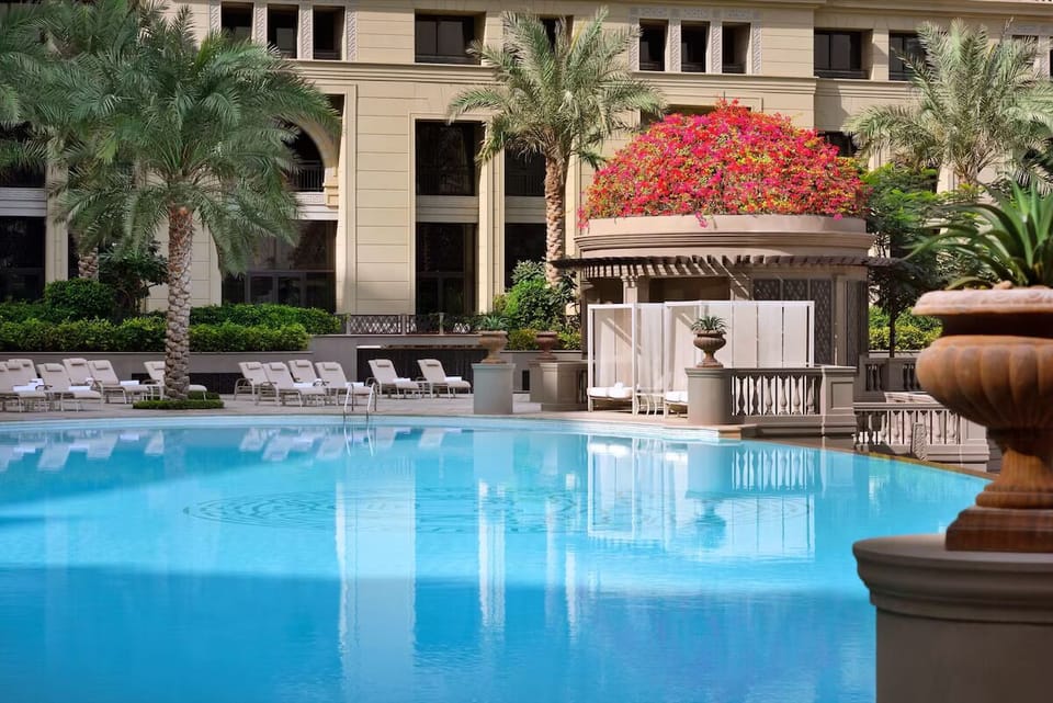 Dive into a sparkling oasis with elegant loungers and shade.