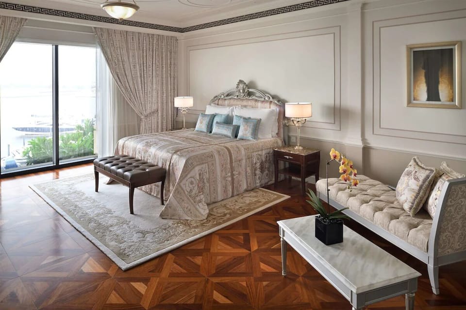Stretch out on a plush king bed beside sunlit windows.