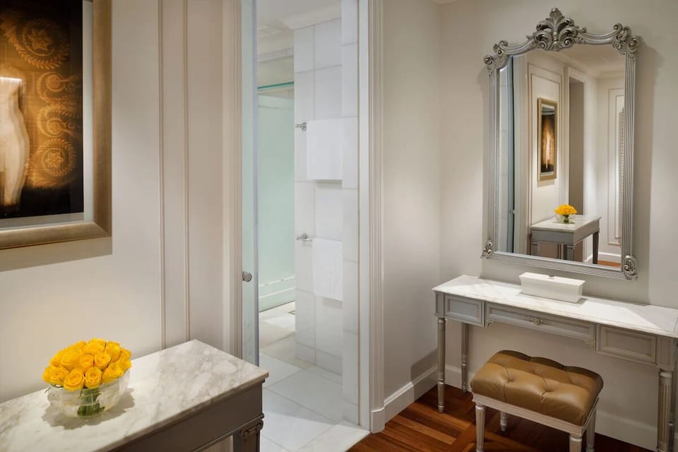 Refresh effortlessly with an elegant vanity and spa-like entryway.