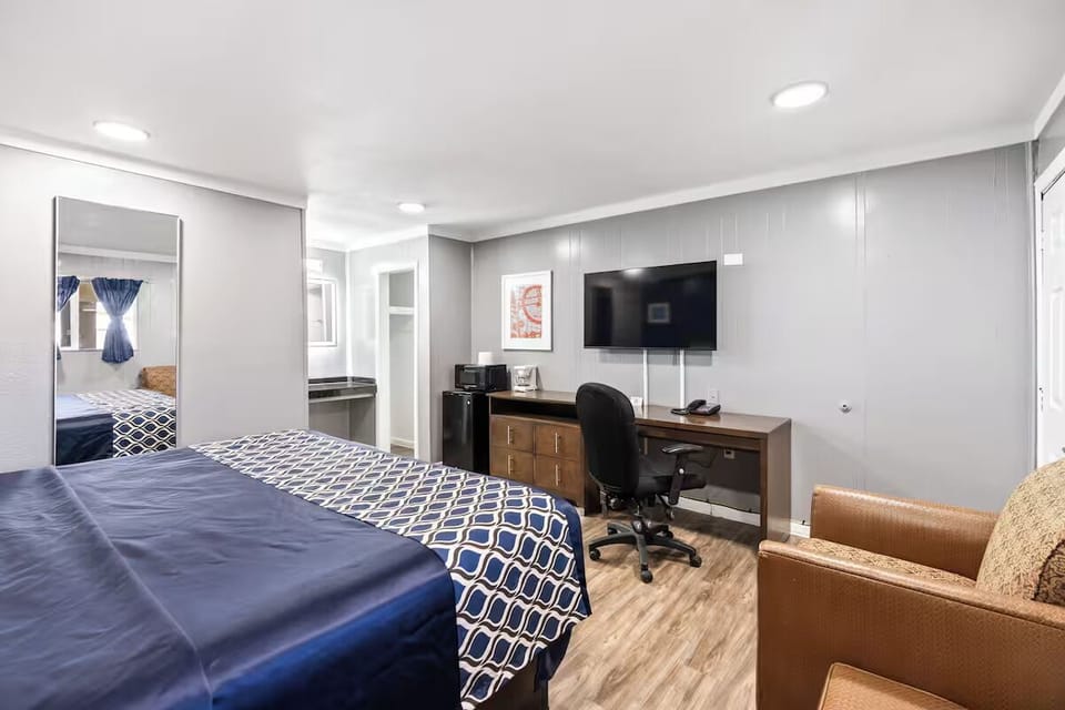 Stretch out in bed while the room’s amenities stay within reach.