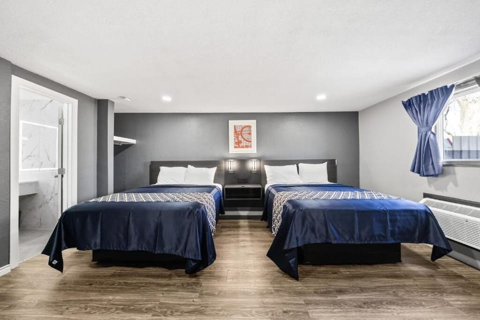 Drift off easily in a bright, calm double-bed setup.