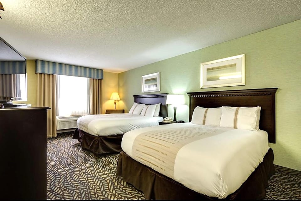 Arrive and relax in a spacious room with two inviting beds.