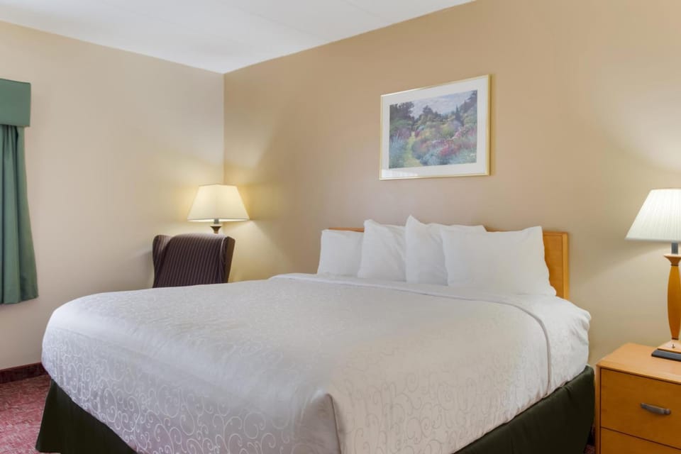 Relax into a serene sleep space with soft bedside lighting.