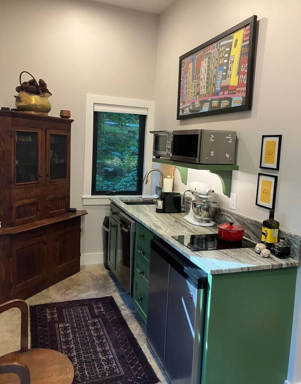 Thoughtfully designed kitchen is fully stocked for extended stays--stainless steel appliances and durable cookware sets. Enjoy convenience of all you need with stylish pieces sprinkled throughout your space.