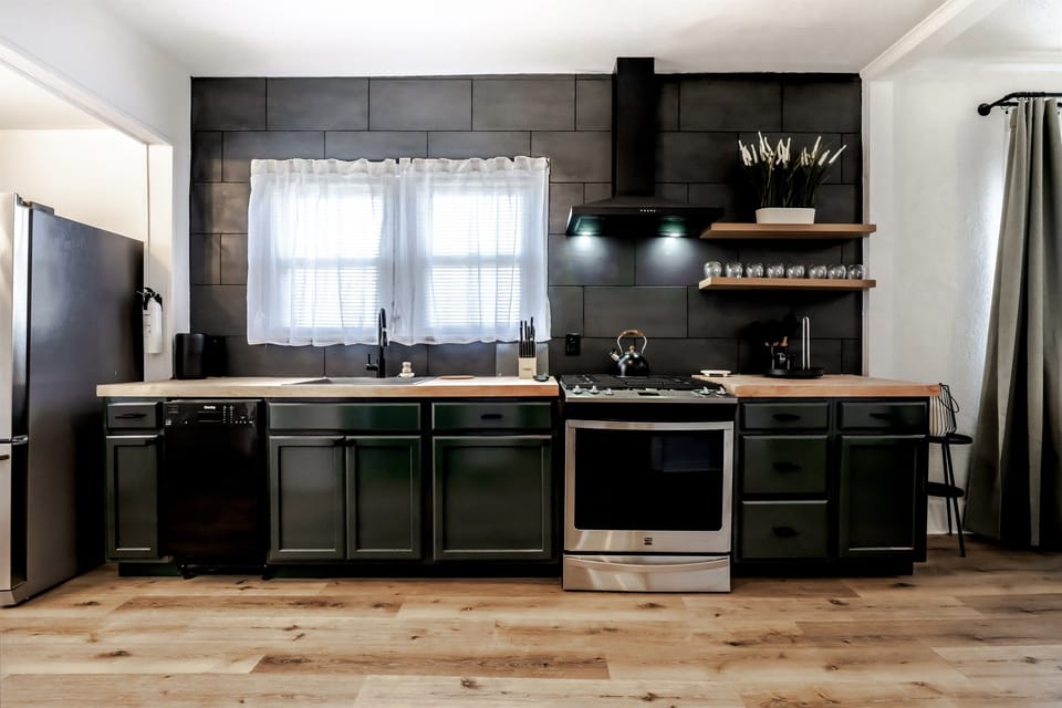 Fully renovated kitchen with dishwasher and butcher block countertops