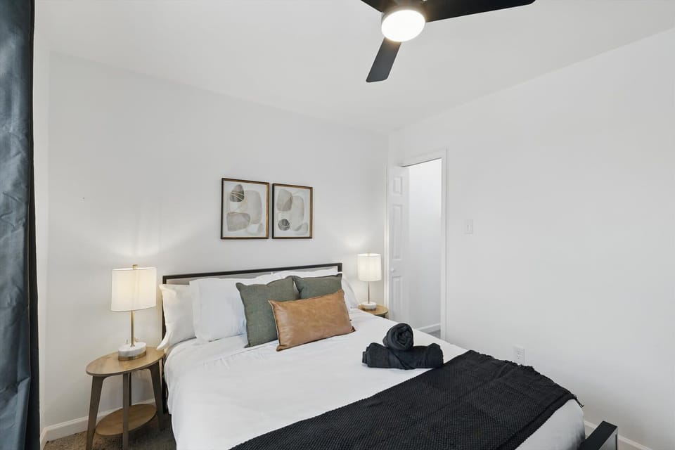 “Fourth Queen Bedroom in Unit 3 with Natural Light”
This serene queen bedroom features soft lighting, cozy linens, and blackout curtains — ideal for a peaceful night’s sleep or a lazy morning in.