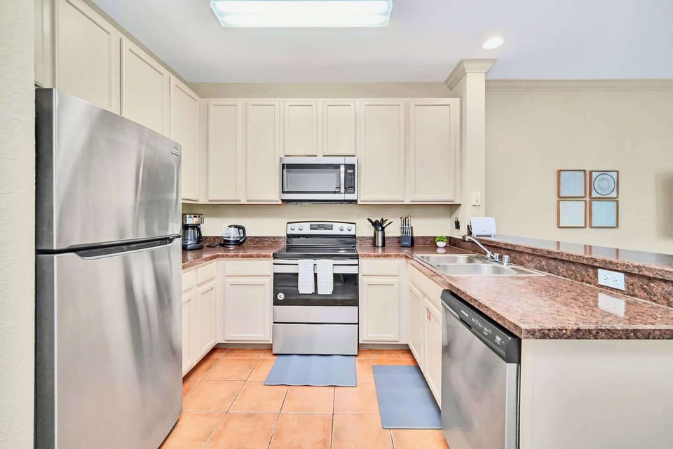 Fully-equipped kitchen with silver appliances