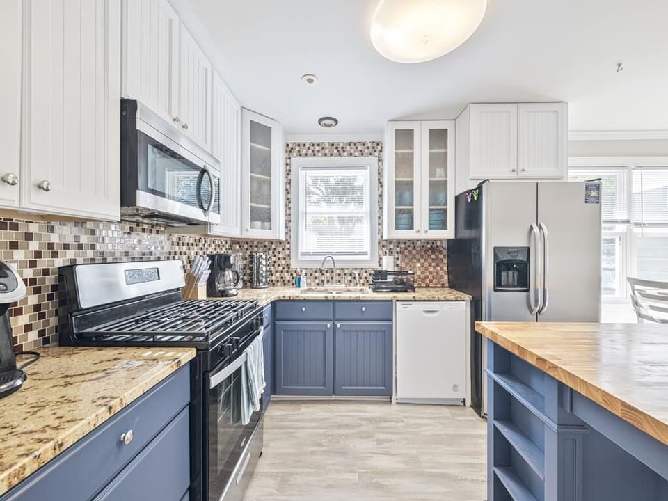 Cook up a feast in this well-equipped kitchen, highlighted by rich countertops and inviting design.