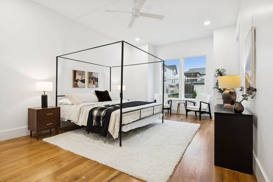 The primary, spacious bedroom suite features a king-sized bed and a gorgeous ensuite bathroom. Located on the first floor.